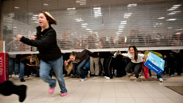 Shoppers sprinting into store at Black Friday sale event