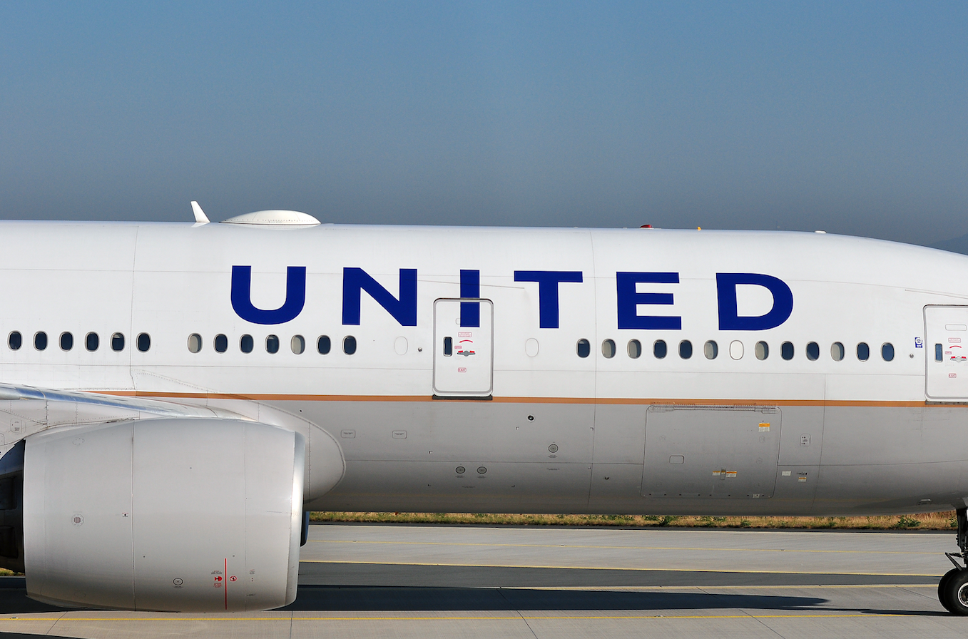 Close-up of commercial airplane with airline branding on fuselage