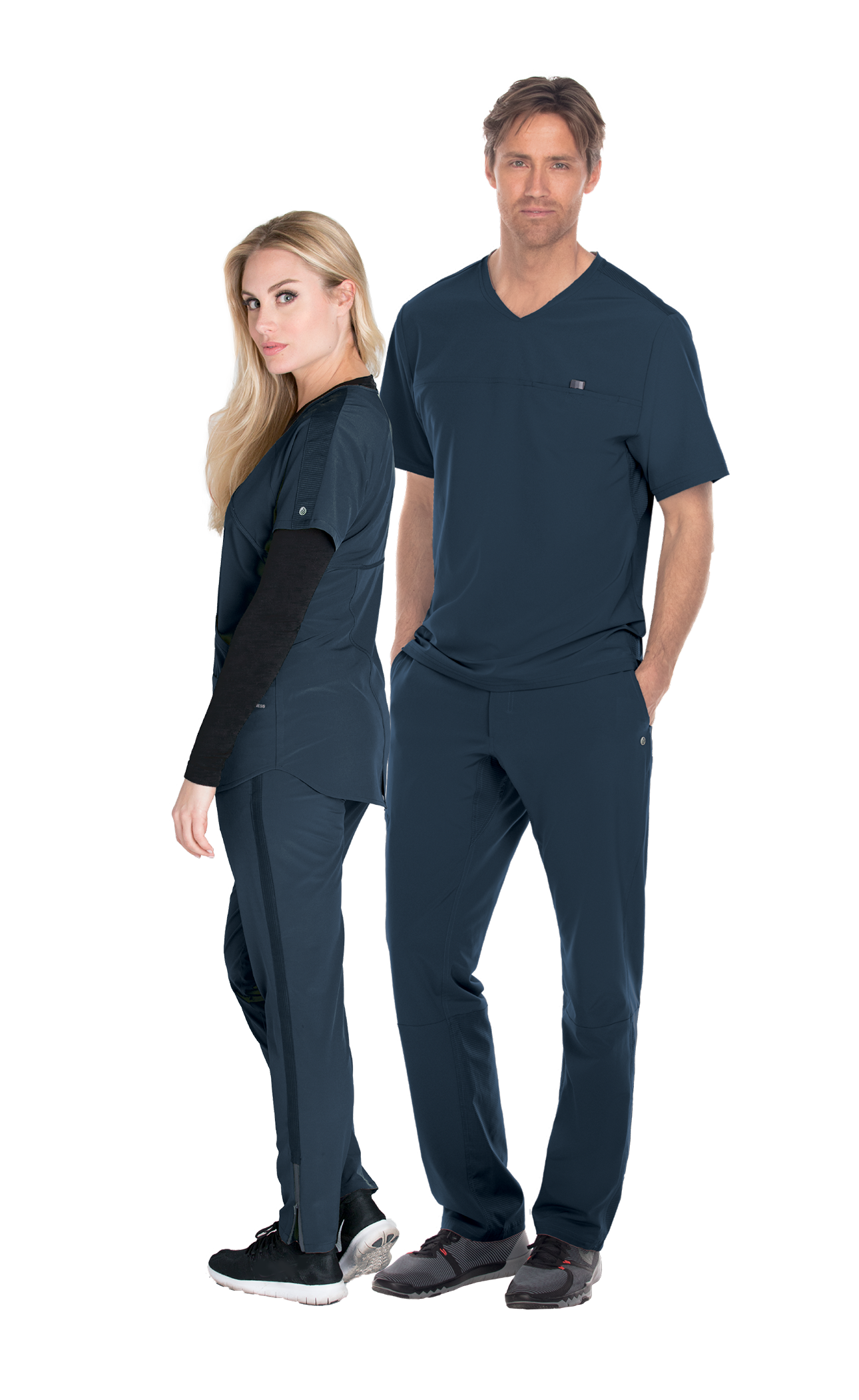 Two healthcare professionals in navy blue scrubs standing back to back