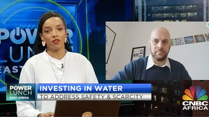 TV host interviewing guest on CNBC Africa about water investment issues