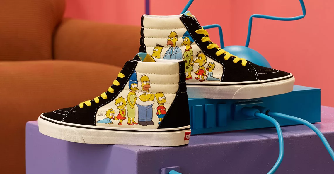 High-top sneakers with cartoon family print on pastel blocks background.