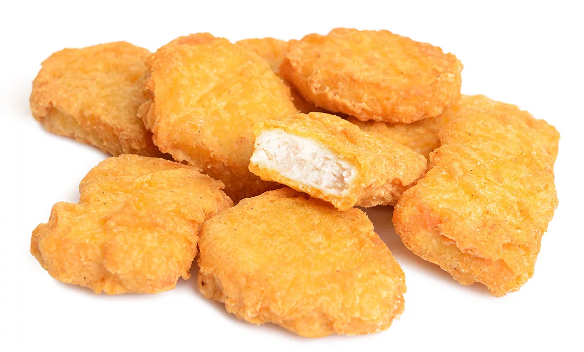 Crispy chicken nuggets on white background