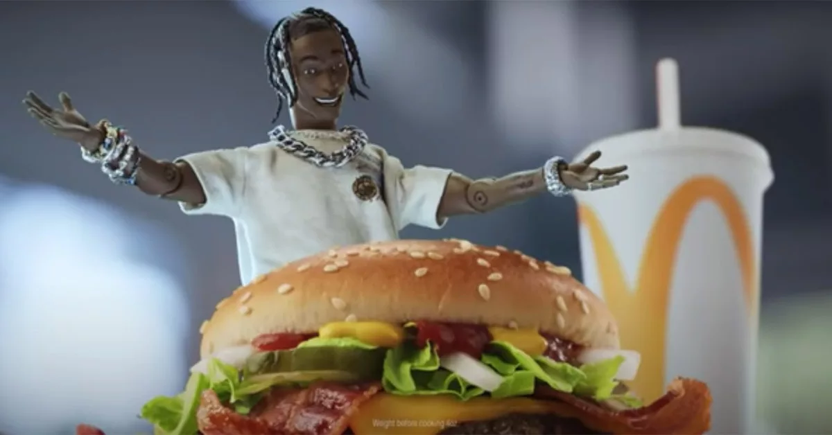 Animated figure presenting a burger and soft drink with the McDonald's logo.