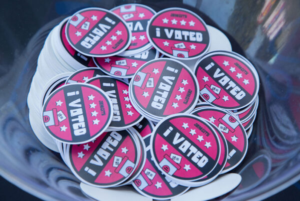 Stack of "I Voted" stickers in a bowl promoting civic engagement