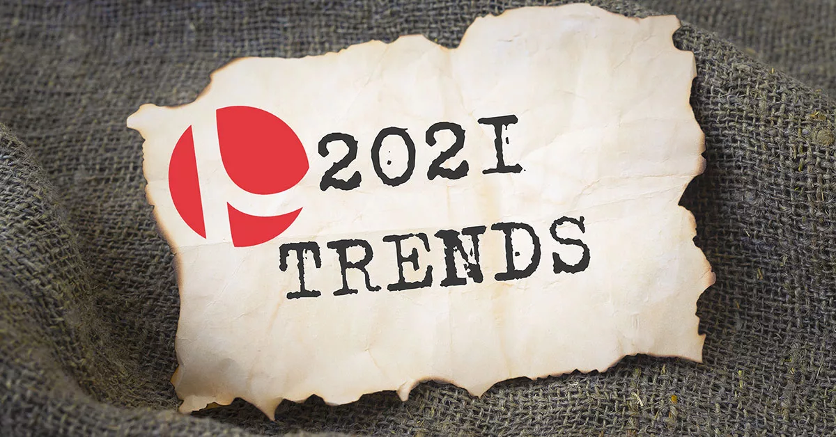 Burnt-edged paper with '2021 Trends' text and a red logo on burlap fabric
