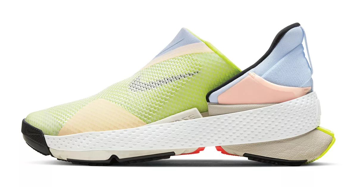 Modern colorful sneaker with innovative design and white sole against white background.