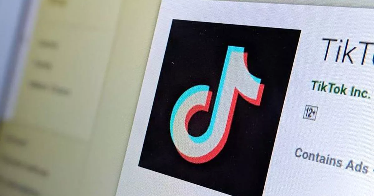 TikTok logo displayed on a digital screen with app age rating.