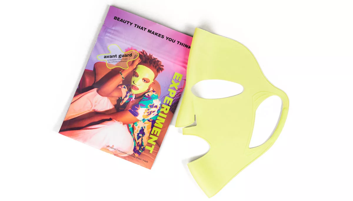 Colorful avant-garde magazine cover next to a yellow facial mask on white background.