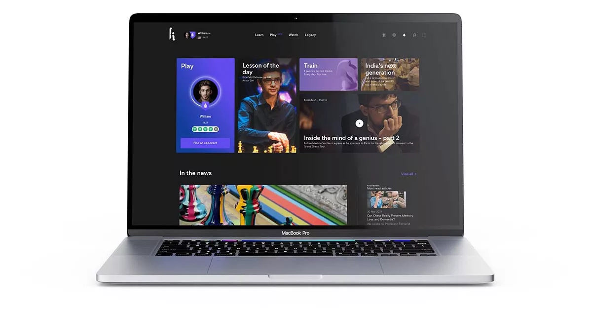 MacBook Pro displaying a colorful user interface with chess and educational content