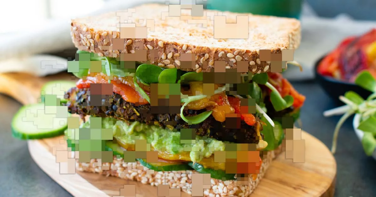 Fresh veggie sandwich on multigrain bread with avocado and sprouts