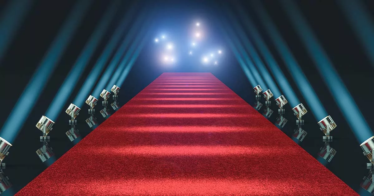 Red carpet runway with spotlights and theater seating on sides