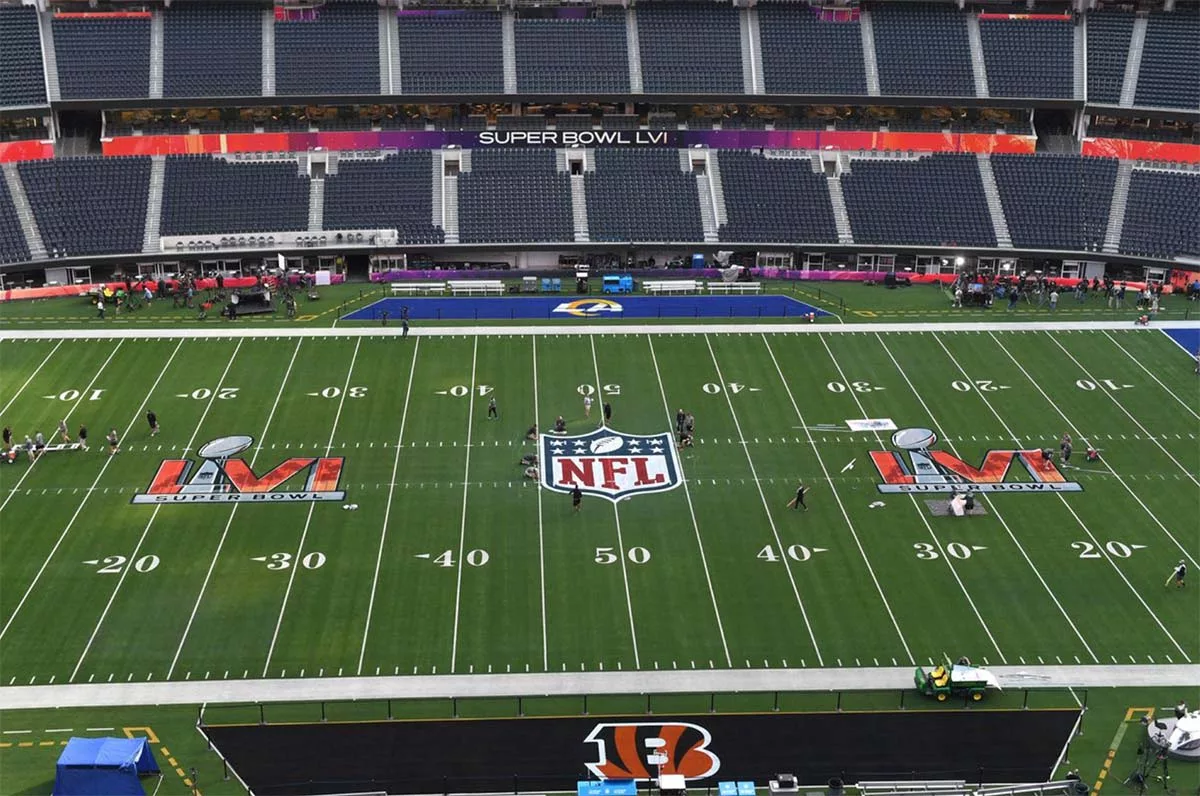 Super Bowl LVI stadium preparation with NFL logo and team endzones visible