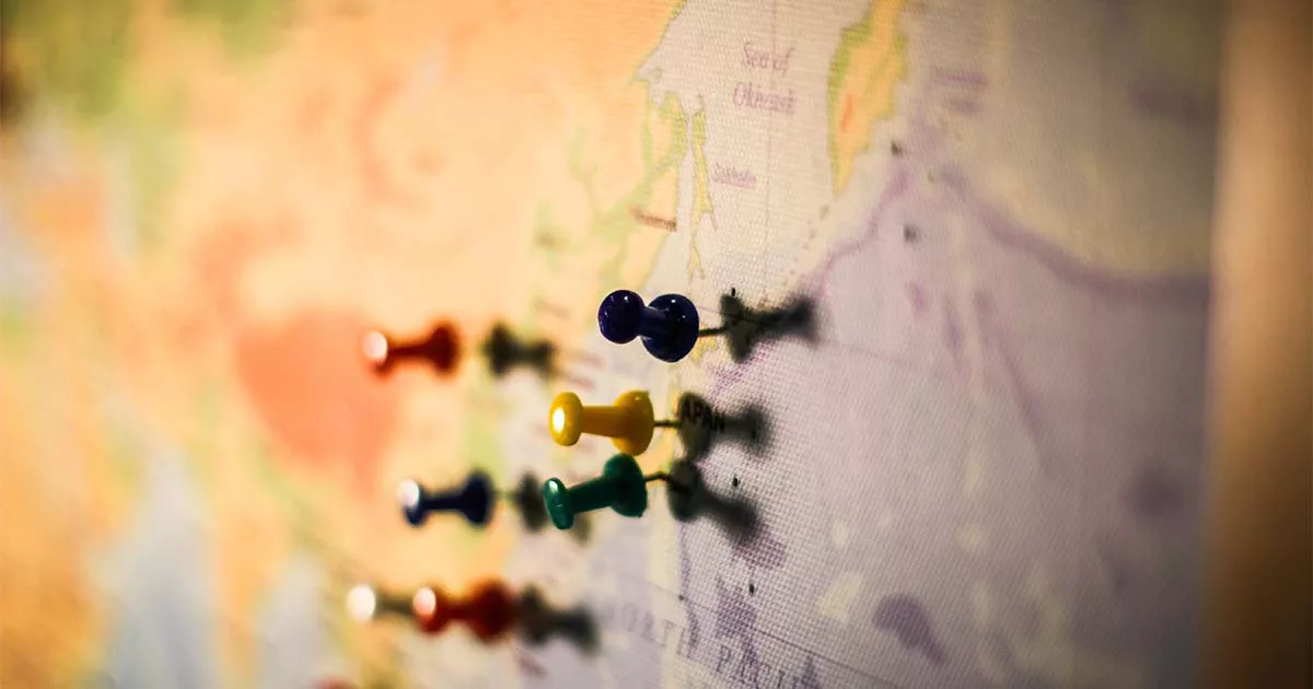 Colorful pushpins on a world map