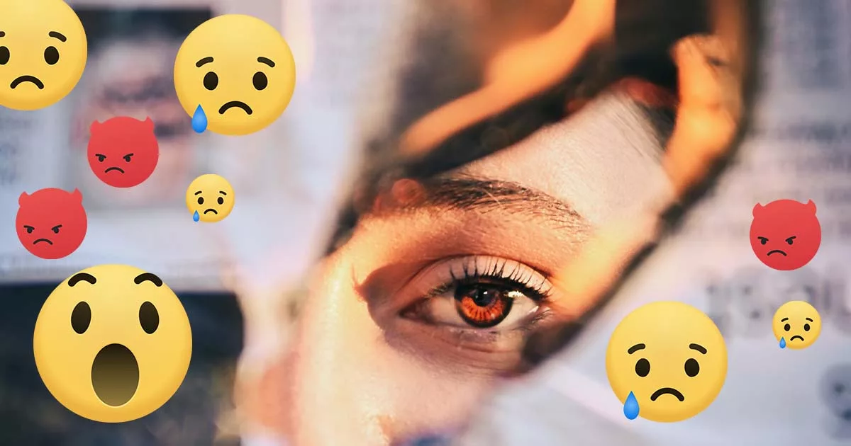 Close-up of an eye with floating emoji expressions of anger