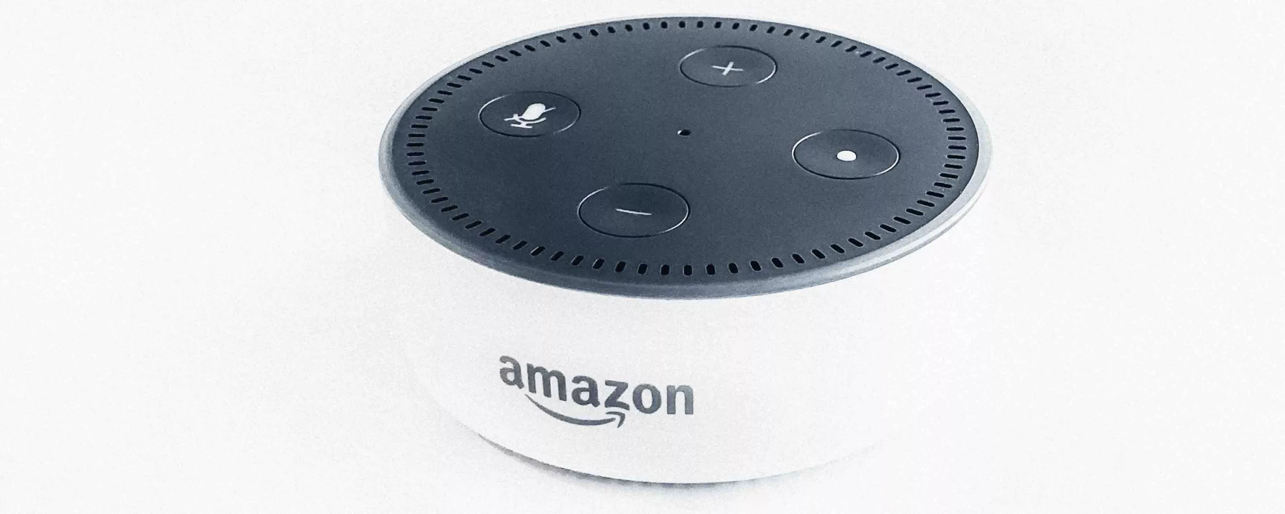 Amazon Echo Dot smart speaker on white background