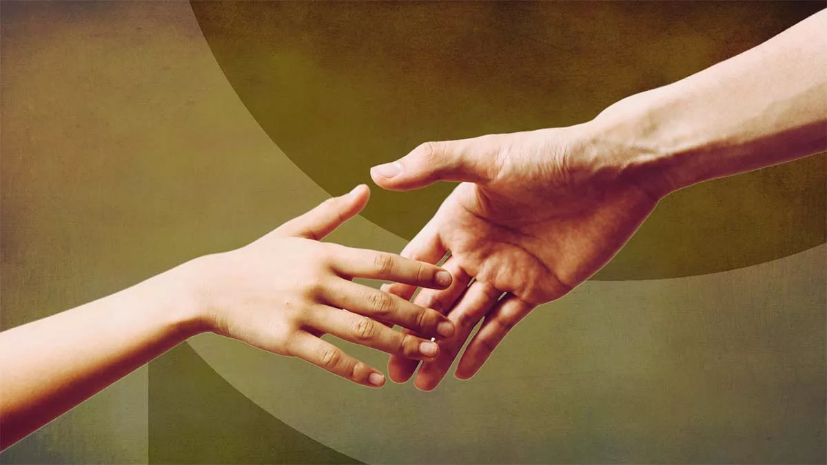 Two hands reaching towards each other against a muted background