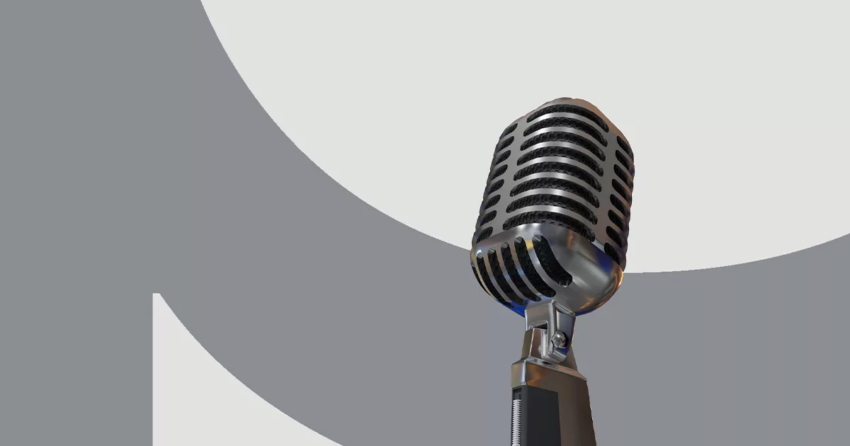 Vintage microphone on stand with abstract grey background