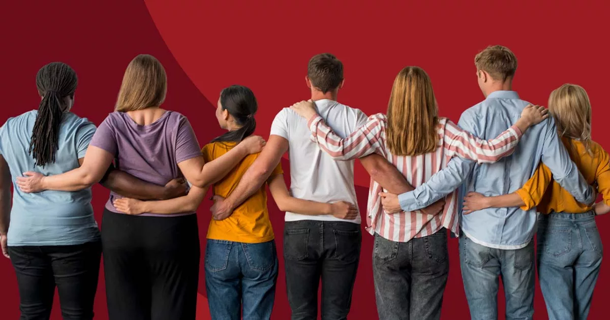Group of diverse people standing together with arms around each other on a red background