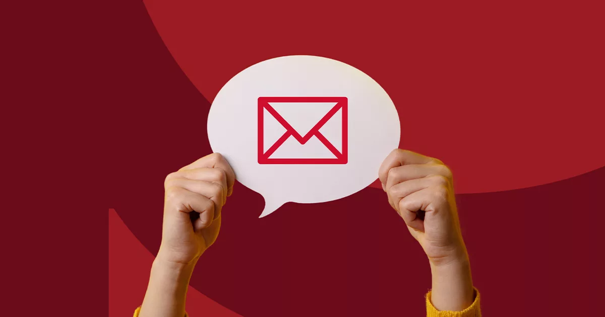 Hands holding a speech bubble with red email icon on maroon background.