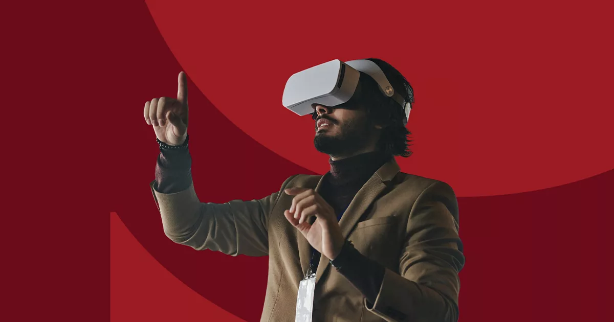 Man in VR headset gesturing on red background