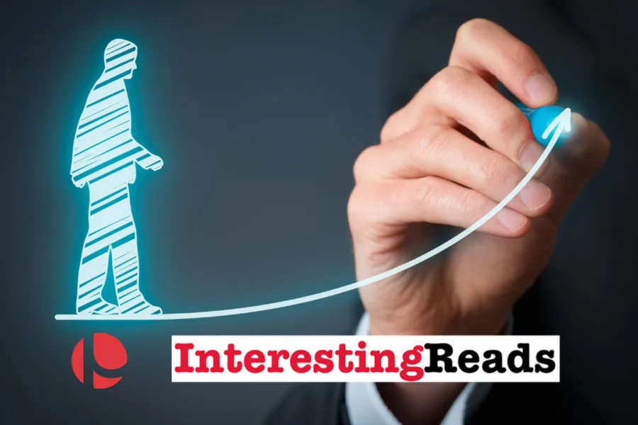 Hand drawing arrow with digital figure and "Interesting Reads" text on dark background.