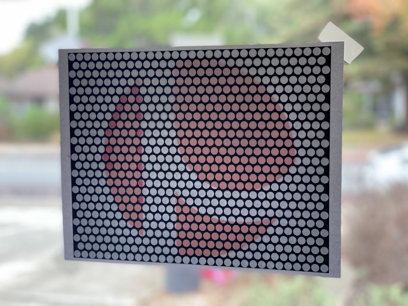 Draw out the Lite Brite layout in Adobe After Effects, blow up the icon to a full size of paper, and trace it out on a window