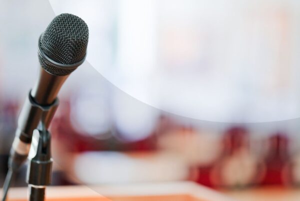 Microphone stand in front of a crowd