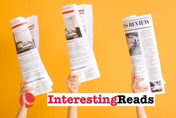 Three hands holding up copies of newspapers against a yellow background.