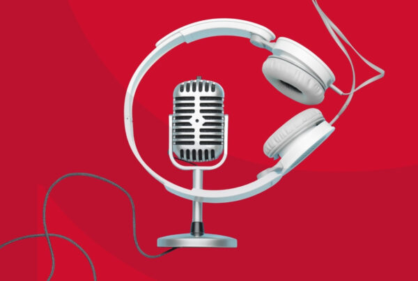 A headset and microphone crossing wires against a red background.